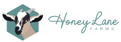 Logo of Honey Lane Farms with a goat's head in a hexagon on the left and the name in script text on the right.