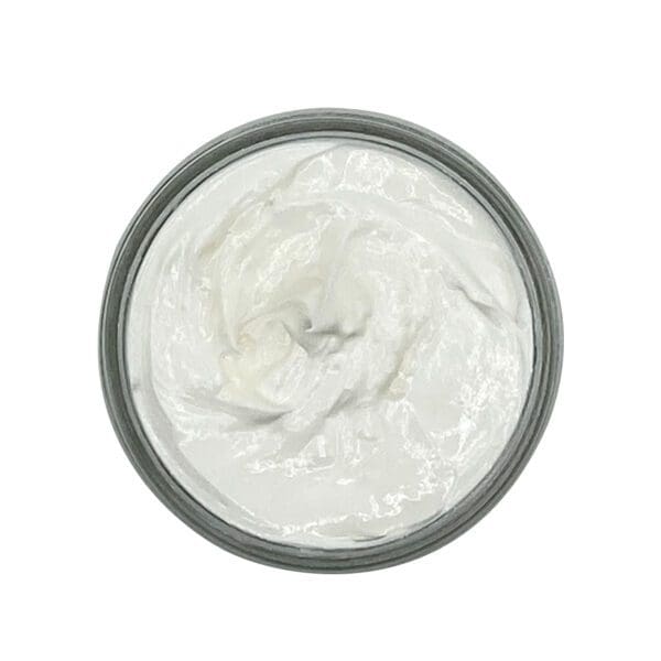 The Citrus Body Butter - 4oz is displayed from above as an open jar filled with a smooth, swirled white cream.