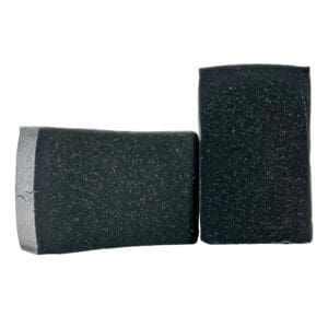 Two rectangular bars of Charcoal soap with textured surfaces are positioned together on a white background.