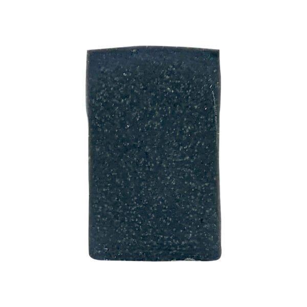 A rectangular, dark blue Charcoal soap bar with a slightly textured surface.