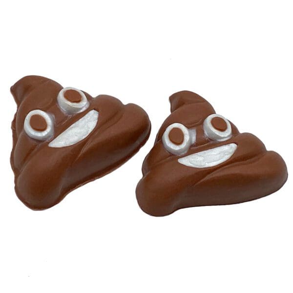 Two chocolate pieces shaped like smiling poop emojis with white and brown eyes and a smile are available in the Emoji product line.
