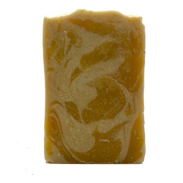 A rectangular "Honeysuckle Jasmine" soap bar featuring a marbled pattern in shades of yellow and beige.