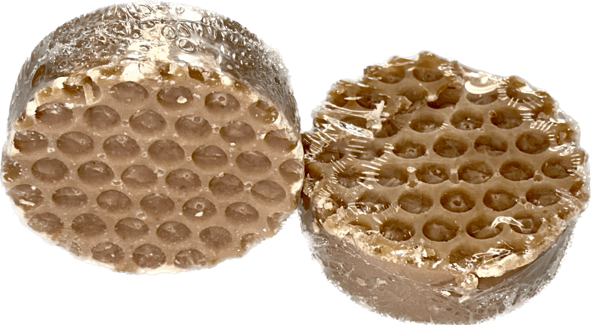 Two cylindrical wax honeycomb blocks, wrapped in plastic, described as "Honey Oatmeal" in sample size 4oz.