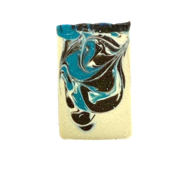 The "Journey" soap is a rectangular bar featuring a marbled design in blue, black, and white.