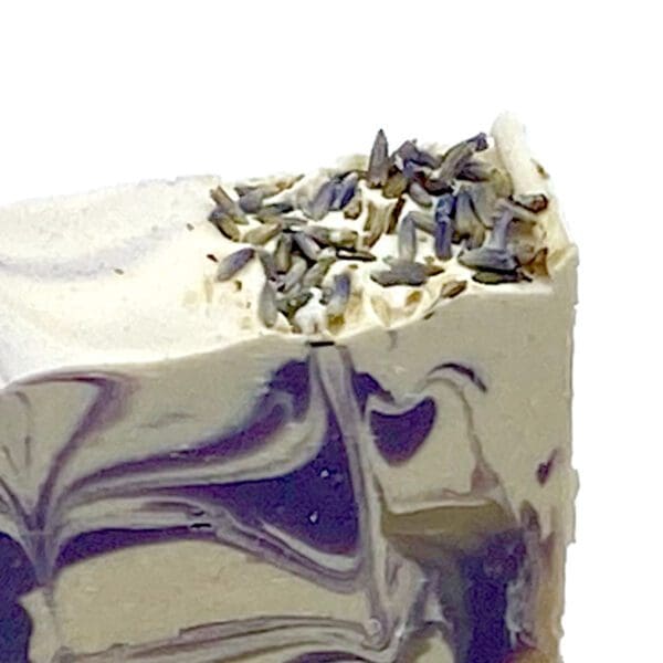 Loving Lavender soap features swirl patterns and a topping of lavender buds.
