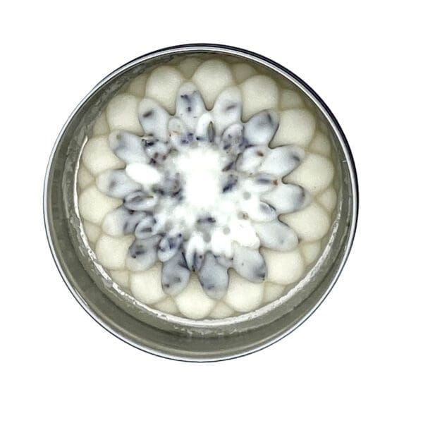 The Loving Lavender Lotion Bar features a circular design with layered flower-like patterns in gray, white, and off-white, radiating symmetrically from the center.