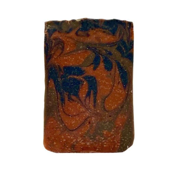 The Pahoehoe bar of soap is rectangular with a marbled design in shades of brown, blue, and orange.