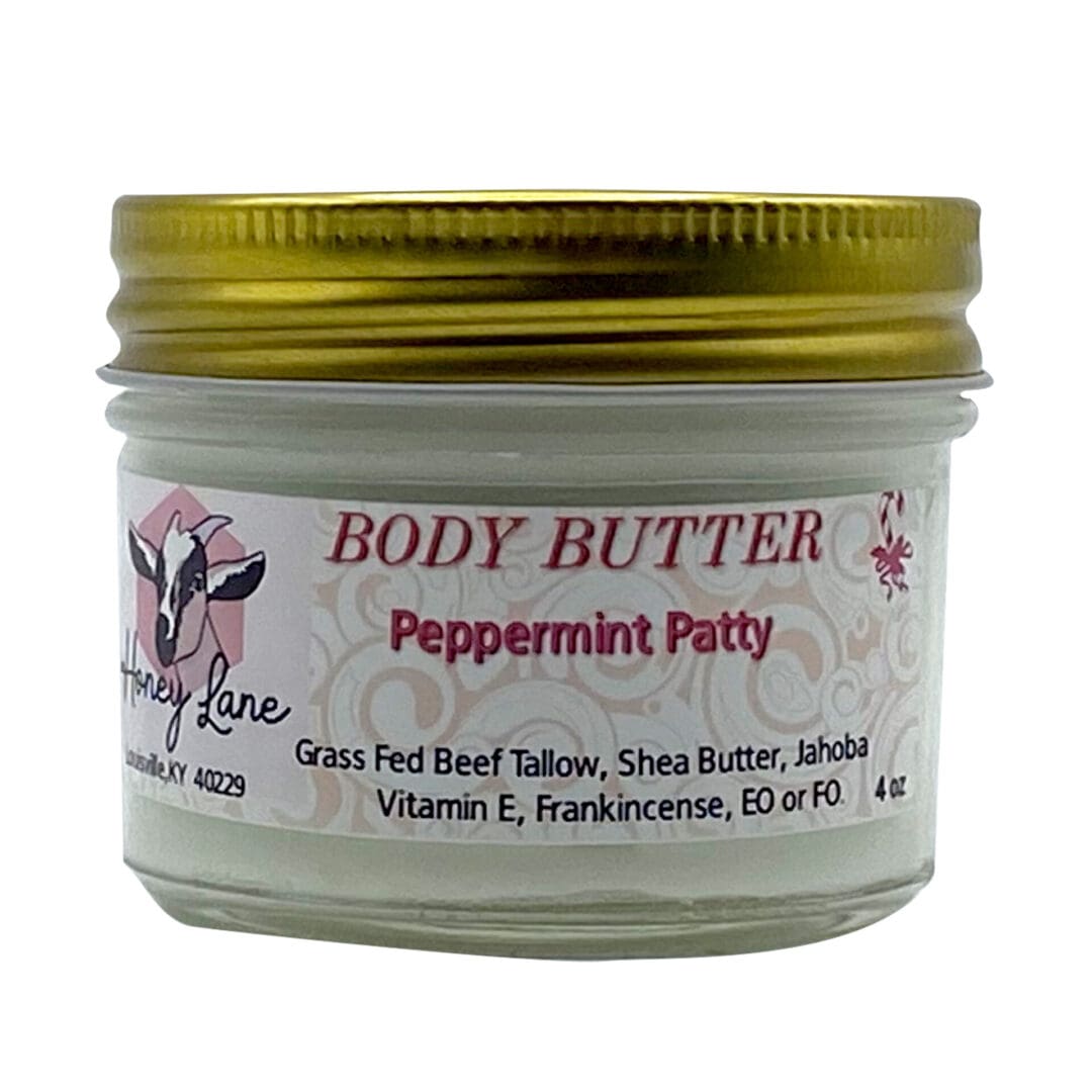 A 4 oz jar of Peppermint Patty Body Butter with a gold lid contains grass-fed beef tallow, shea butter, and jojoba.