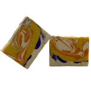 Two Plumeria bars with a marbled orange, yellow, and purple pattern on white.