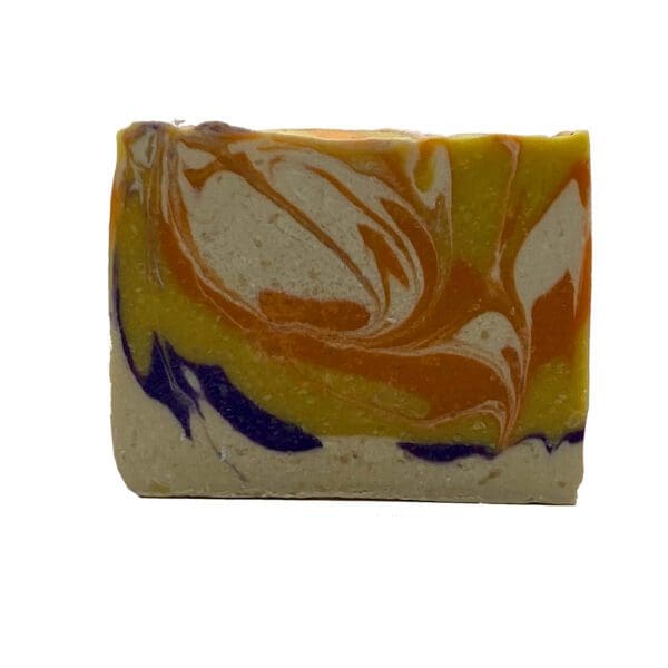 The Plumeria bar soap features a swirling design of orange, yellow, and purple on a beige base.