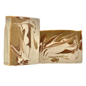 Two Pumpkin Streusel swirl-patterned soap bars with brown, cream, and gold marbling against a white background.