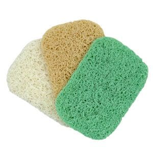 Three Soap Dish Pads in white, tan, and green are layered on a white background.