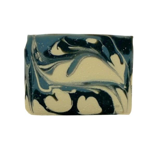 The Suit & Tie soap features a rectangular shape with a marbled pattern of swirling black, white, and beige.